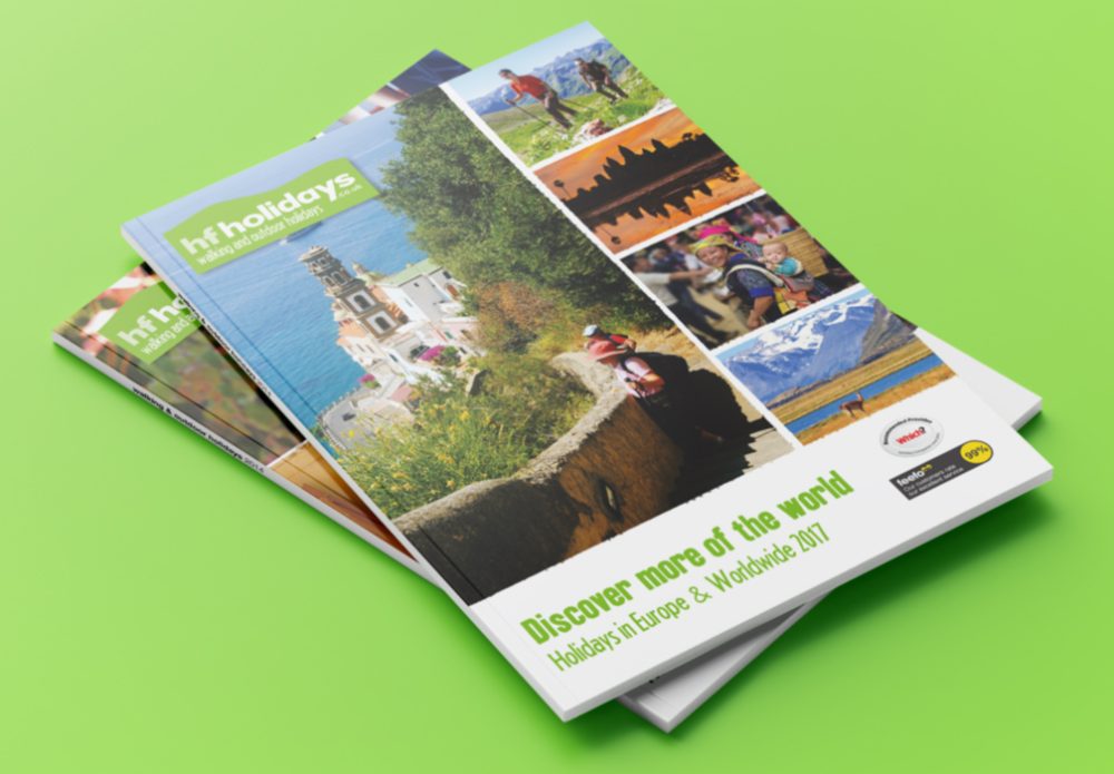Stack of two different HF Holiday Brochures showing the cover and spine design - Travel Brochures.